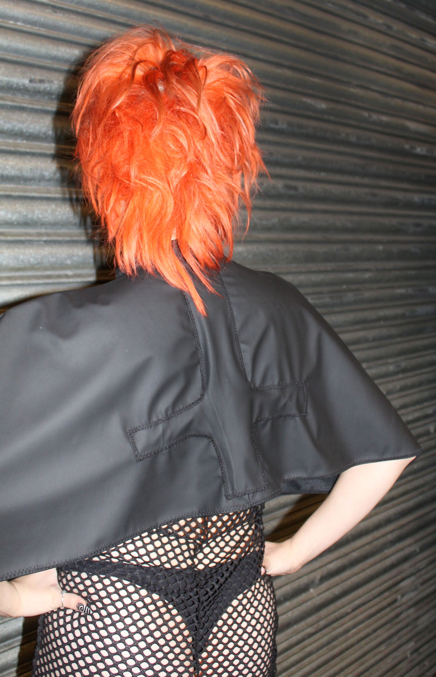 "HEL” BLACK PLEATHER CAPE WITH CRUCIFIX DETAIL